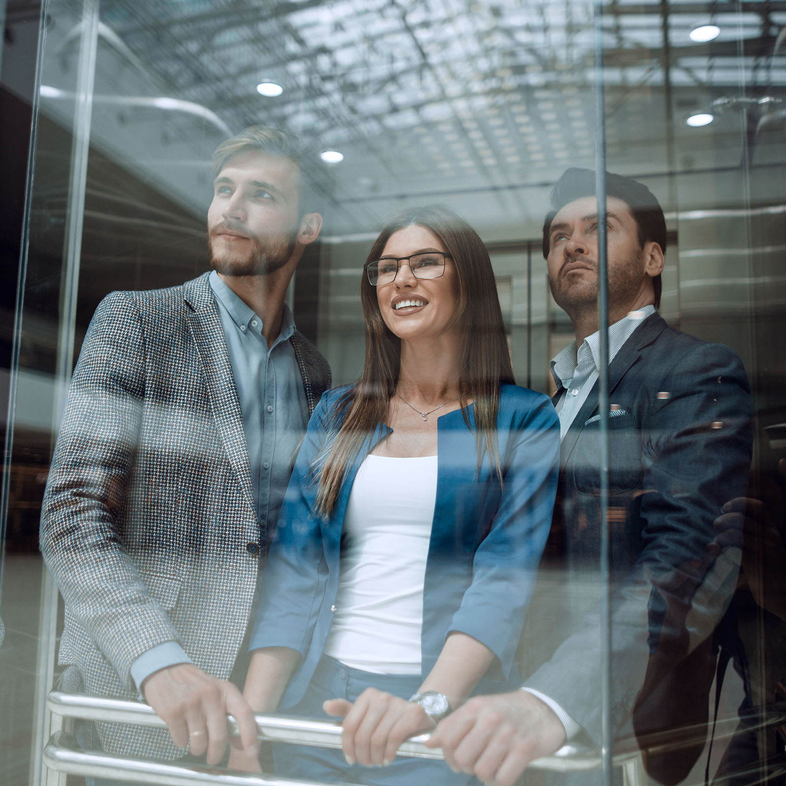 Business team group going on elevator.business concept